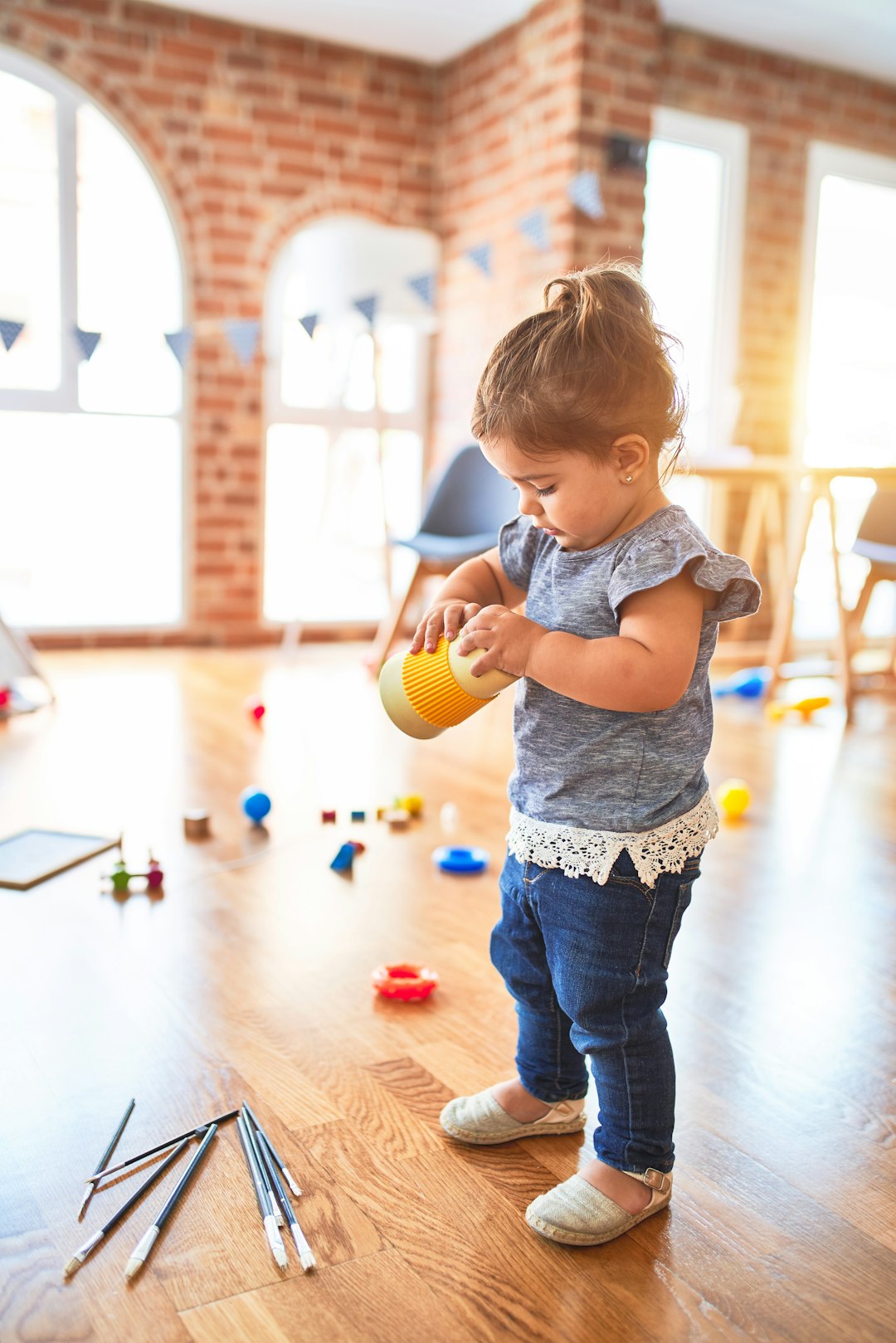 A candid photo of a toddler playing, the kind the AI picks