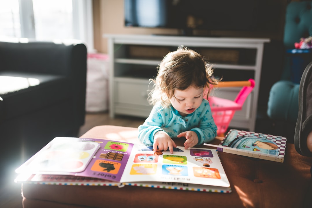 A toddler flipping through a book